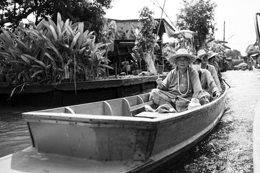 A black and white photo of people in a boat