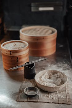 Bowl of Flour and Bamboo Steamers on the Table